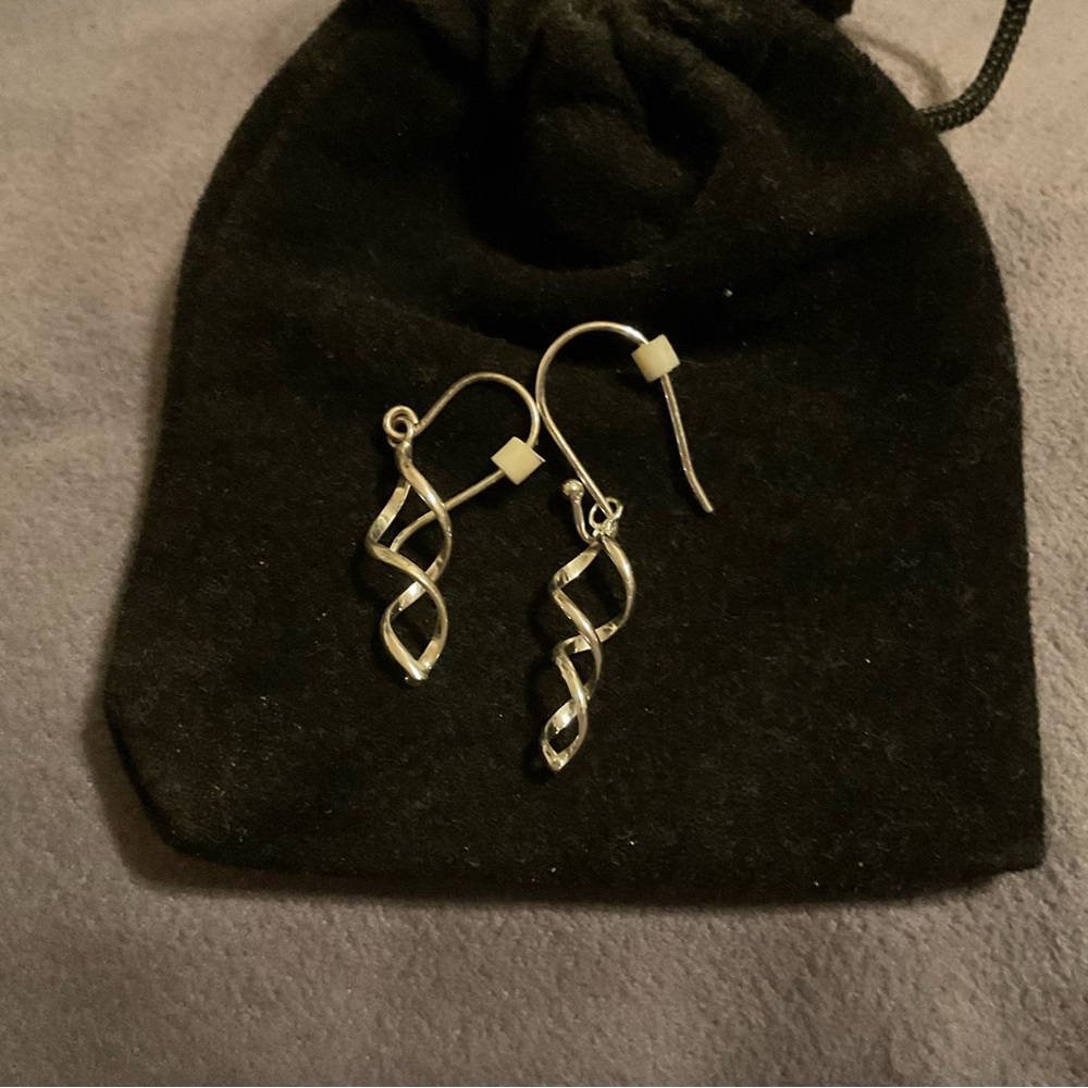 Silver swirl dangling earrings